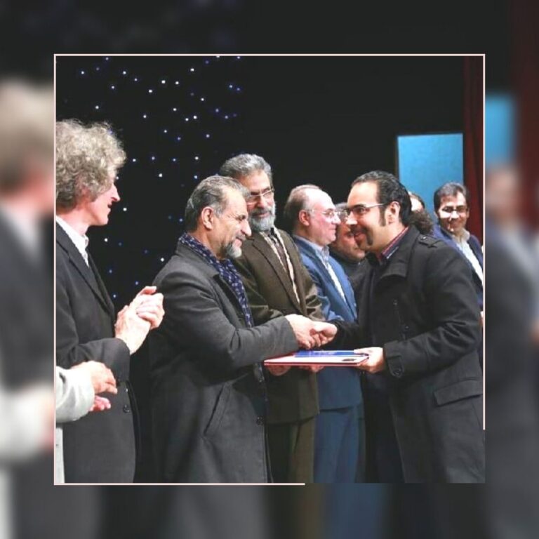 mehrdad-ranjbar-receiving-award.jpg